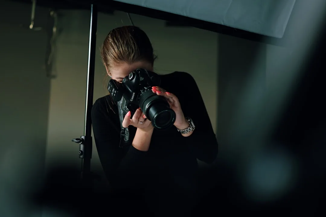Photographer working on her business and website strategy, planning how to rewrite vague copy into clear agent-ready service descriptions