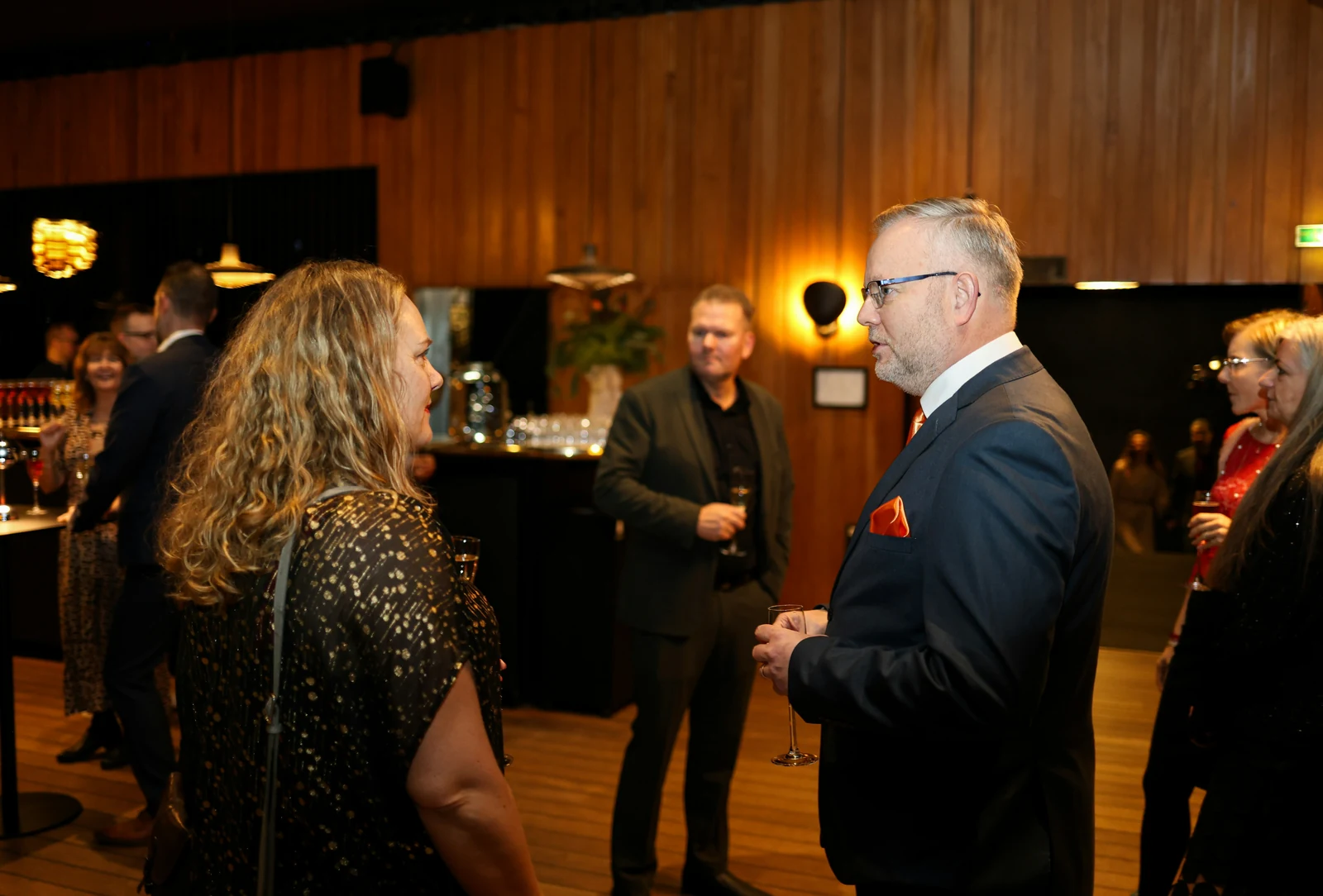 Professional networking event with attendees connecting and mingling