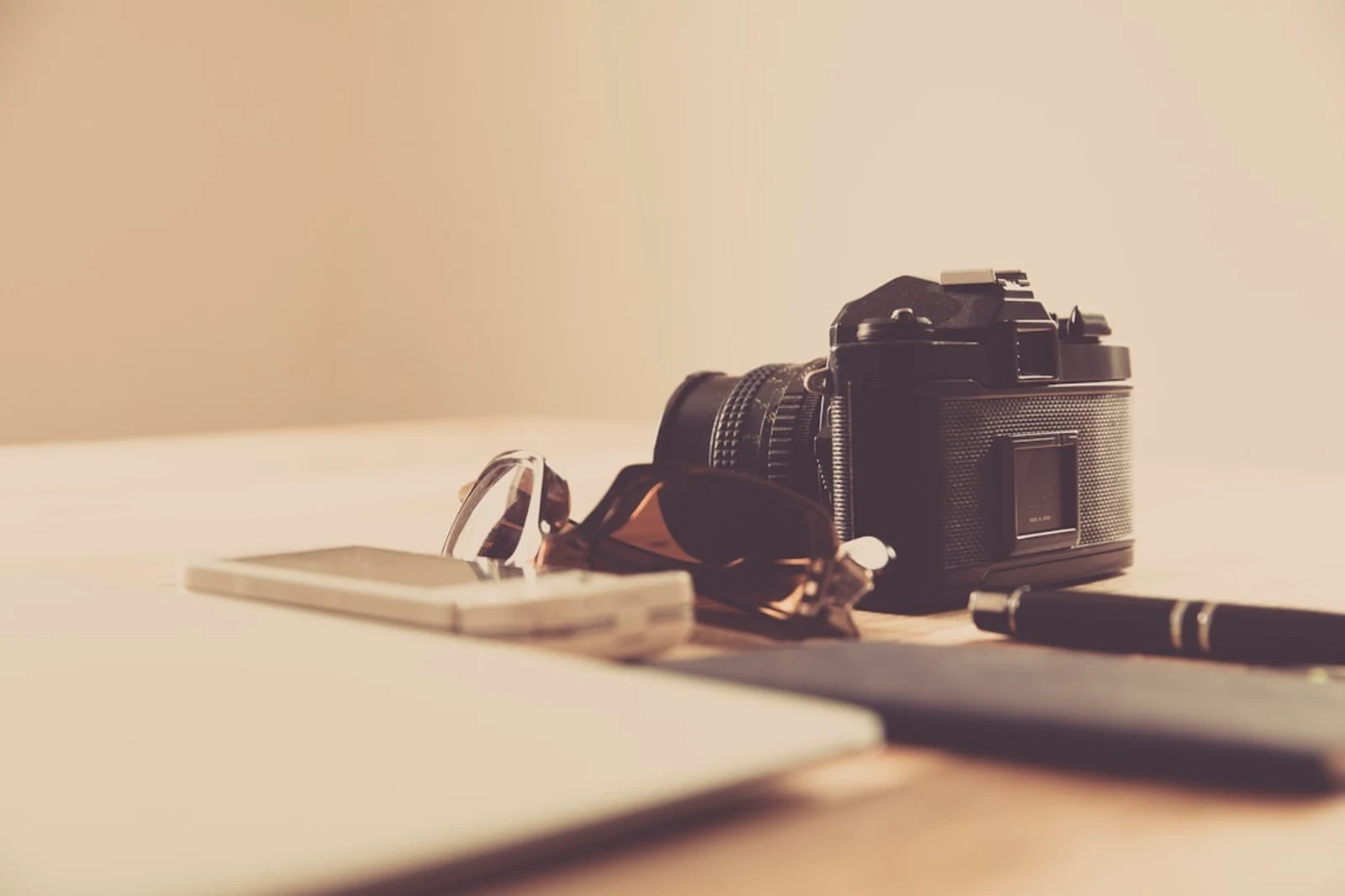 Photographer reviewing email marketing metrics and analytics on laptop