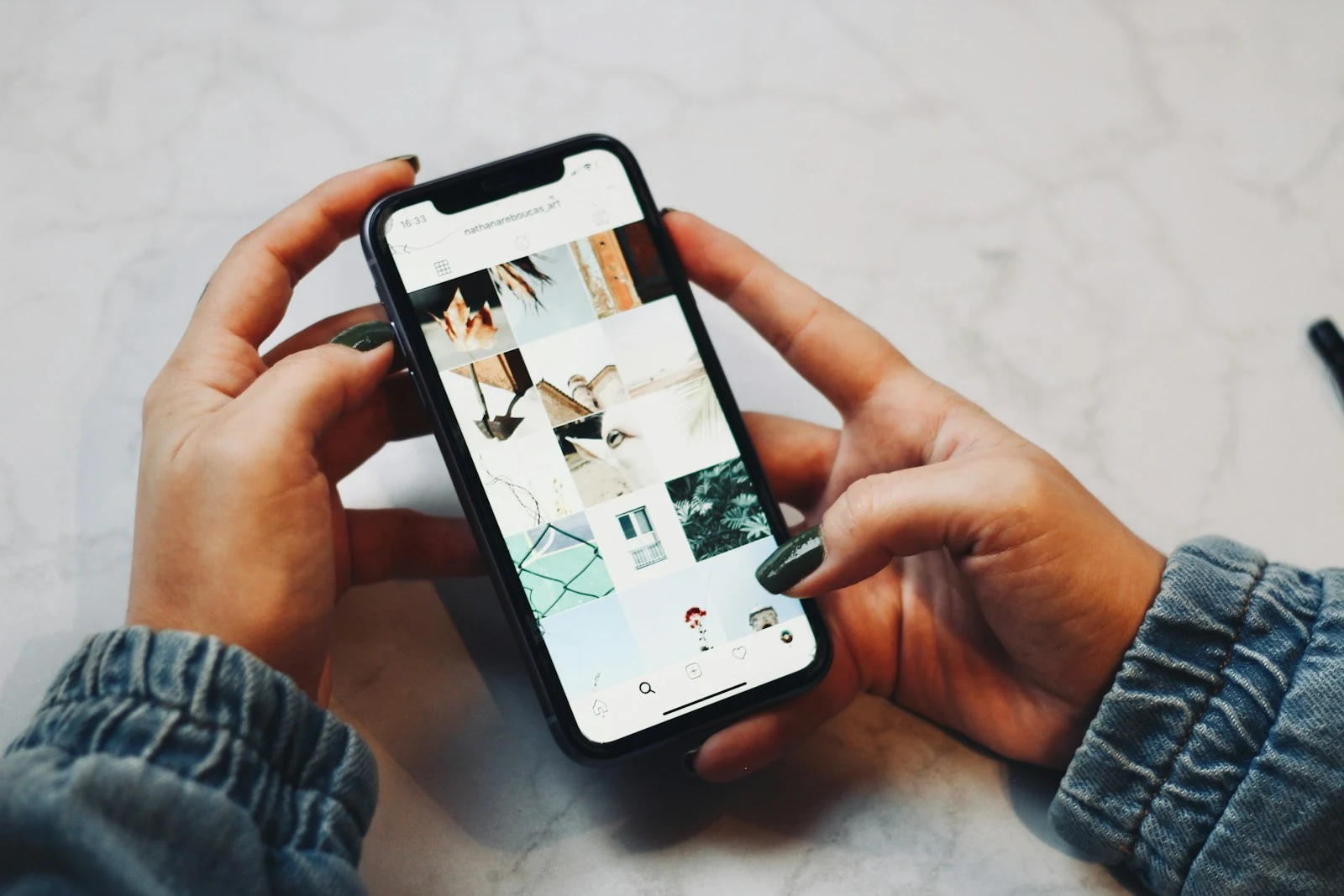 Person scrolling Instagram Reels on phone