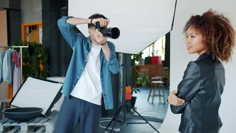 Professional photographer directing a portrait session — the sessions that become your best ads