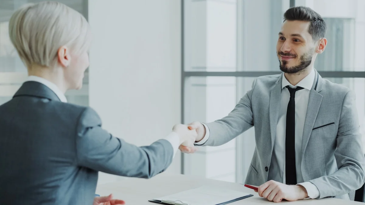 Two professionals reviewing and signing a client service agreement at a desk