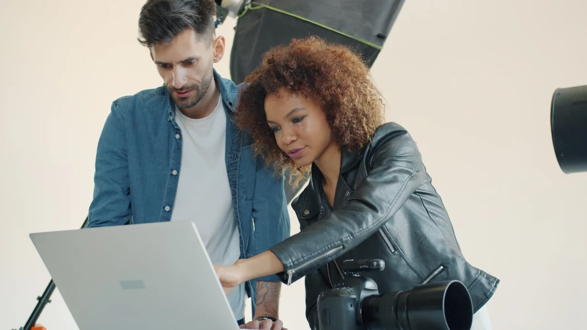 Photographer reviewing photography portfolio and booking system on a laptop